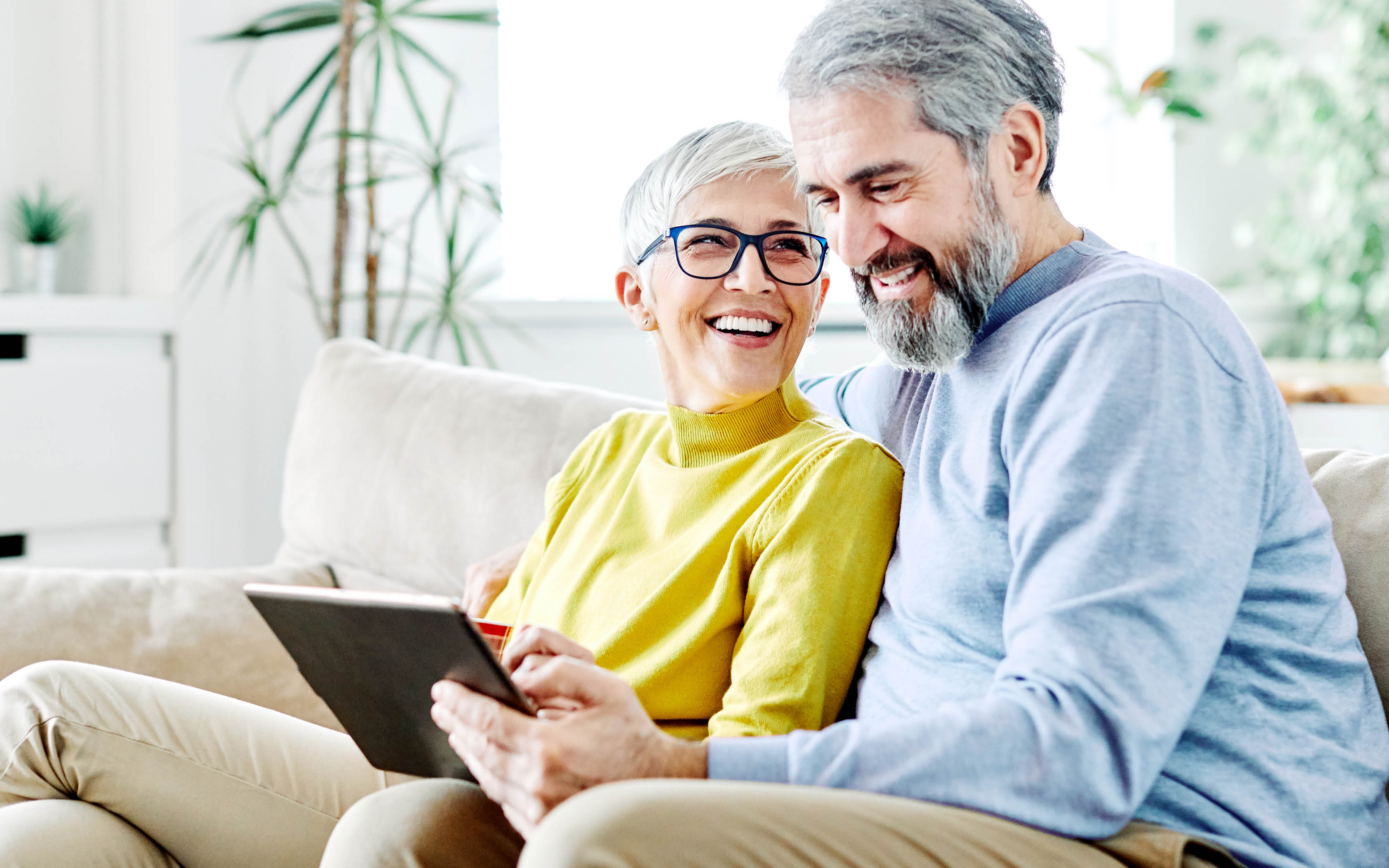 Couple reading a tablet 